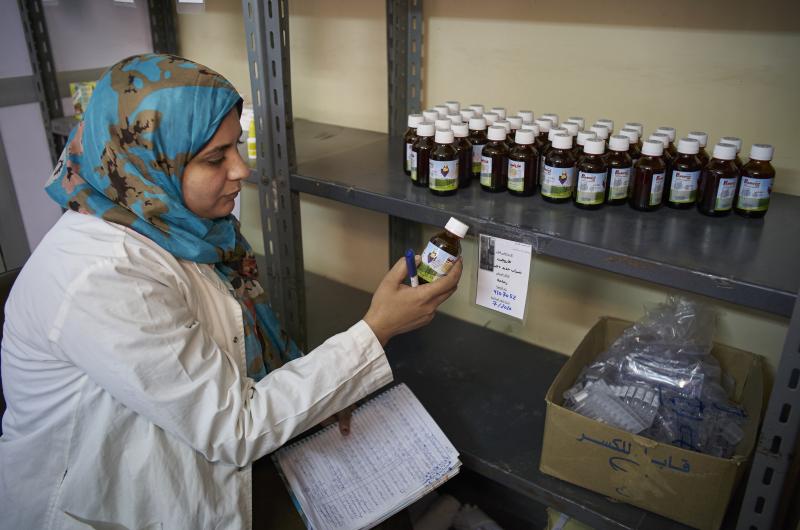 A pharmacist organizes medicines at the pharmacy in UNICEF supported Asmeet Primary Healthcare Unit (PHU), Kafr Shukr town in the Qalyubia Governorate. Egypt.